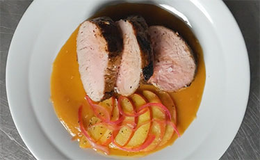 Roast pork with apples, pickled onion and fresh apple sauce